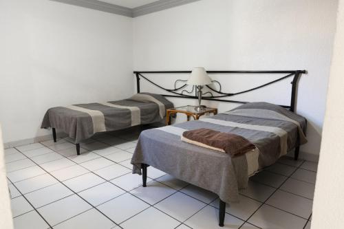 Postel nebo postele na pokoji v ubytování Lofts Oaxaca