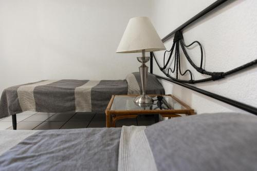 Postel nebo postele na pokoji v ubytování Lofts Oaxaca