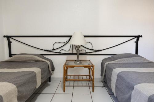Postel nebo postele na pokoji v ubytování Lofts Oaxaca