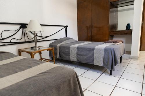 Postel nebo postele na pokoji v ubytování Lofts Oaxaca
