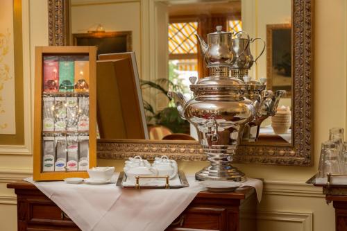 a trophy sitting on a table in front of a mirror at Atlantic Parkhotel in Baden-Baden
