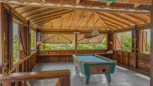 an empty room with a pool table in it at Lushes Lodge unit 2 in Vieux Fort
