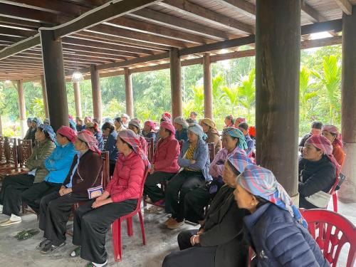 a large group of people sitting in chairs in a building at Sapa Orange Homestay in Sa Pa