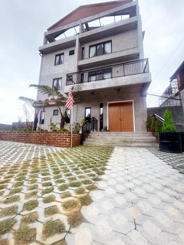 a house with a flag in front of it at Silvan Garden Cameron Highlands in Tanah Rata