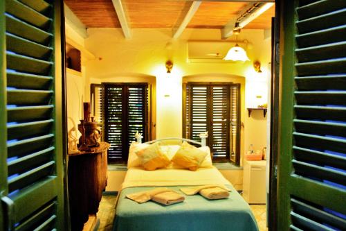 a bedroom with a bed with two towels on it at Cemil İpekçi Pension in Bodrum City