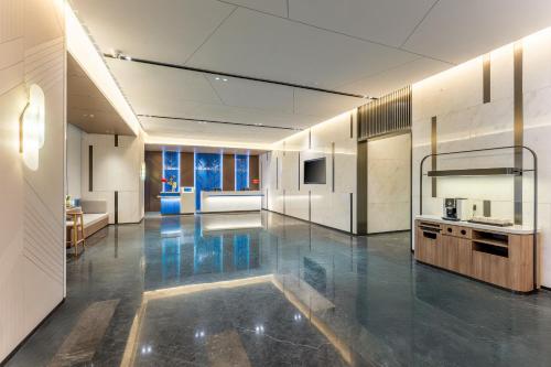 a large room with a kitchen and a living room at Holiday Inn Express Shenzhen Guangming by IHG in Shenzhen