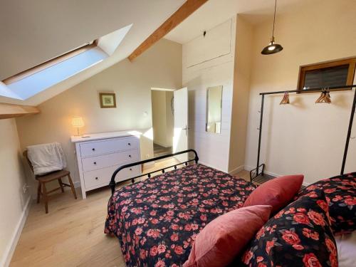 a bedroom with a bed and a dresser in it at Gîte en Touraine avec piscine privée, spa et WiFi - FR-1-381-601 in Cussay