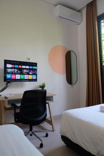 Μια τηλεόραση ή/και κέντρο ψυχαγωγίας στο Olivia SOHO Guest House