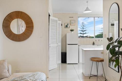 a kitchen with a white refrigerator and a sink at Pad Off Pier - 2BR, Wifi in Glenelg