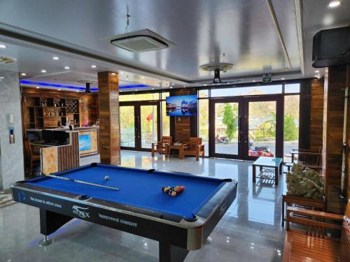 a pool table in the middle of a living room at View Point - Anh Quan in Cat Ba