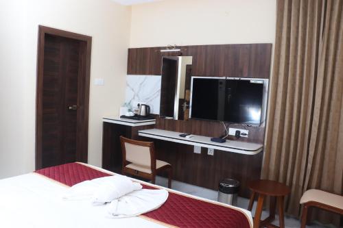 Televisyen dan/atau pusat hiburan di Sree Grand Inn