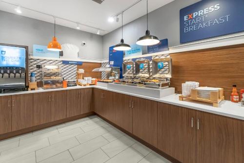 a store with a checkout counter in a store at Holiday Inn Express Salt Lake City South - Midvale by IHG in Midvale