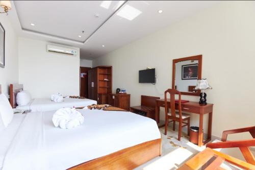 Кровать или кровати в номере Phuoc My An Beach