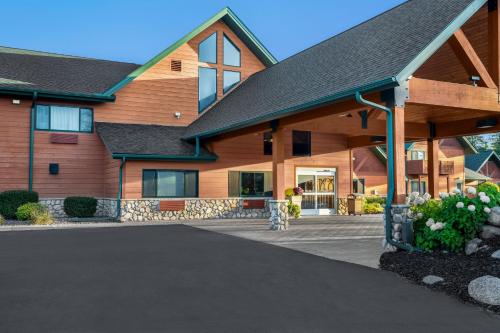 a house with a driveway in front of it at Holiday Inn Express & Suites Hayward by IHG in Hayward