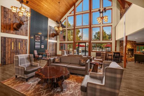 a large living room with furniture and a large window at Holiday Inn Express & Suites Hayward by IHG in Hayward
