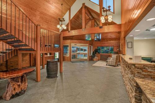 a large room with wooden ceilings and a staircase at Holiday Inn Express & Suites Hayward by IHG in Hayward