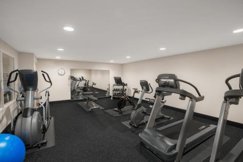 a gym with several treadmills and cardio machines at Holiday Inn Express & Suites Hayward by IHG in Hayward