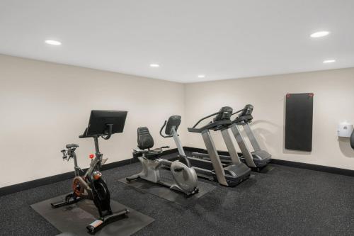 a gym with several cardio equipment in a room at Holiday Inn Express & Suites Hayward by IHG in Hayward