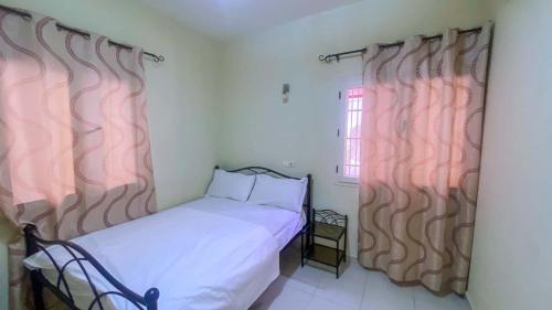 Résidence Nopeli tesisinde bir odada yatak veya yataklar