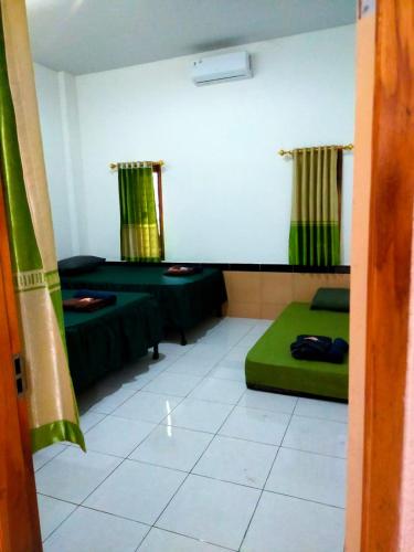 Кровать или кровати в номере Al Kiswah Homestay