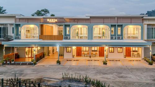 a large building with a lot of windows at Bania 813 House in Khao Lak