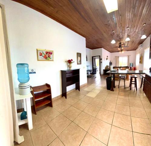 a living room with a table and a dining room at Sunset Views Apartment, West End in West End