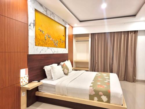 Ένα ή περισσότερα κρεβάτια σε δωμάτιο στο GM Guest House Canggu