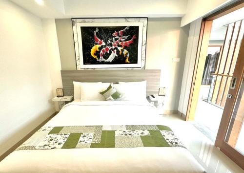 Ένα ή περισσότερα κρεβάτια σε δωμάτιο στο GM Guest House Canggu
