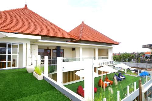 Κήπος έξω από το GM Guest House Canggu