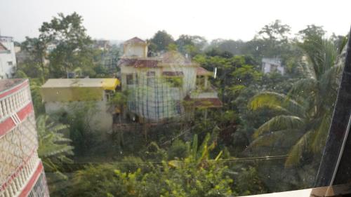 a view of a house from a window at ARK Hotels in Rānchī