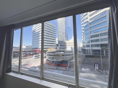 a view of a city from a window at Serain Chatswood Central in Sydney