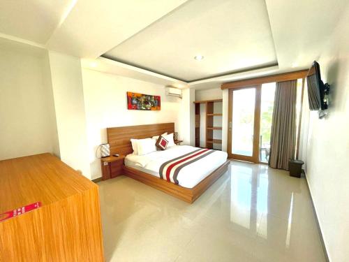Ένα ή περισσότερα κρεβάτια σε δωμάτιο στο GM Guest House Canggu