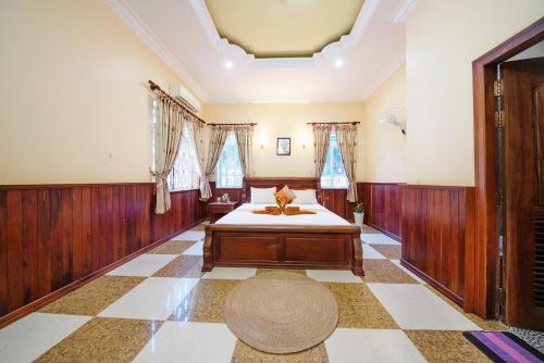a bedroom with a bed in a room at Twin Villa Siem Reap in Siem Reap