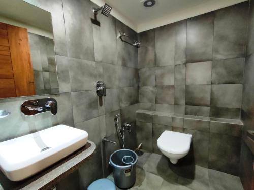 Koupelna v ubytování Hotel Kinara