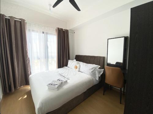 MayaBay Residence SplashMania Gamuda Cove Homestay by Sleepy Bearにあるベッド