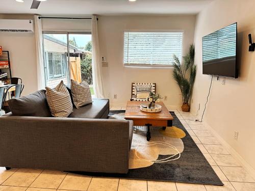 a living room with a couch and a table at Pet friendly Spacious 3Bed with HUGE Back Yard in San Diego