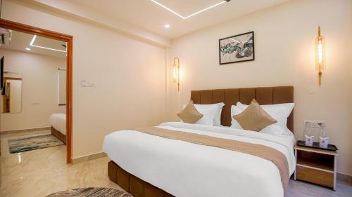 Ένα ή περισσότερα κρεβάτια σε δωμάτιο στο Perfectstayz Premium Varanasi
