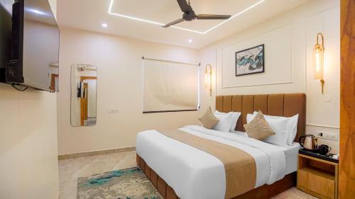 Ένα ή περισσότερα κρεβάτια σε δωμάτιο στο Perfectstayz Premium Varanasi