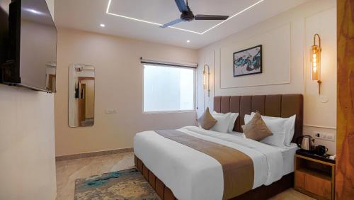 Ένα ή περισσότερα κρεβάτια σε δωμάτιο στο Perfectstayz Premium Varanasi