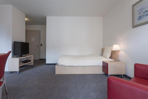 Μια τηλεόραση ή/και κέντρο ψυχαγωγίας στο EMA House Serviced Apartments Seefeld