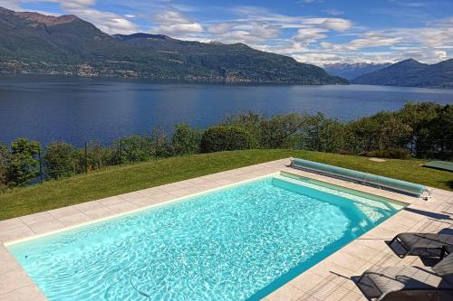 a swimming pool with a view of a lake at Casa Antonia - Happy Rentals in Porto Valtravaglia