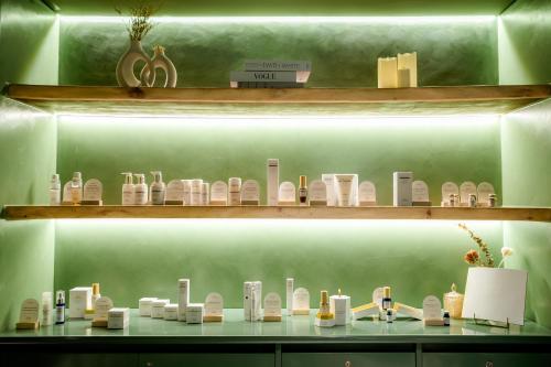 a display of glass items on a shelf at voco Ma Belle Danang by IHG in Da Nang