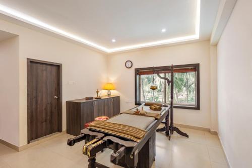 a hospital room with a bed and a window at Sterling Palavelli Godavari in Rāzole