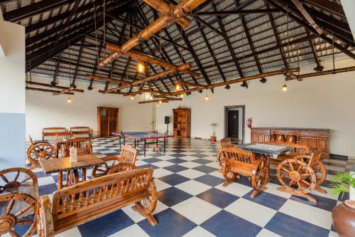 a room with ping pong tables and chairs at Sterling Palavelli Godavari in Rāzole
