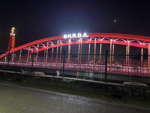 a stadium lit up in red at night at Hotel Shiv Inn By Hotelist in Haridwār