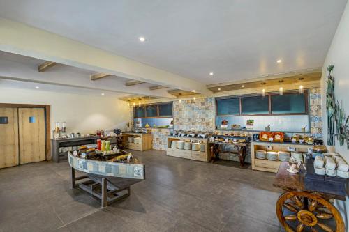a large kitchen with a lot of food at Sterling Palavelli Godavari in Rāzole