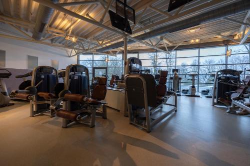 a gym with a bunch of chairs in a room at Fletcher Hotel-Restaurant Arnsberg-Sauerland in Arnsberg