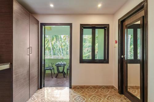 an empty hallway with a door and a table at Sterling Palavelli Godavari in Rāzole