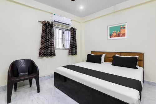 Postel nebo postele na pokoji v ubytování Hotel O Ramam