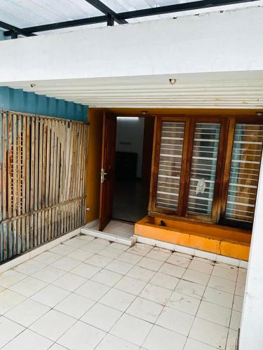 an empty house with a door and windows at Stay Confo Villa in Puducherry